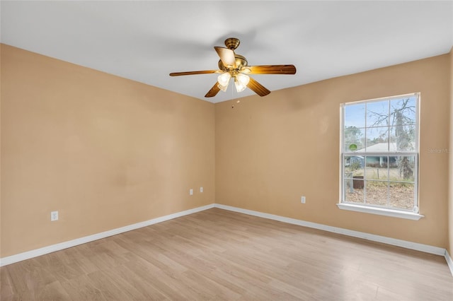 empty room featuring ceiling fan and light hardwood / wood-style flooring