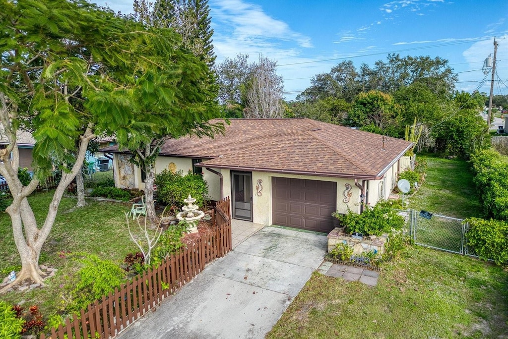 ranch-style house with a front lawn and a garage