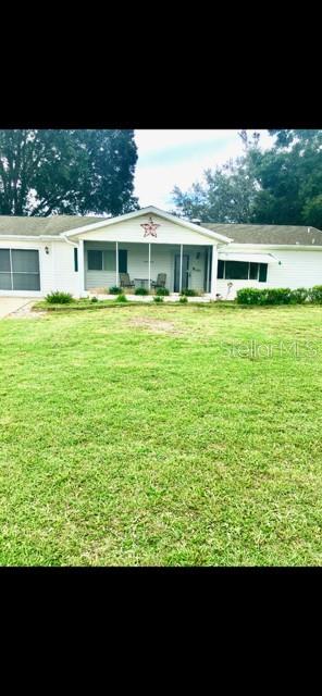 view of front of home featuring a front lawn