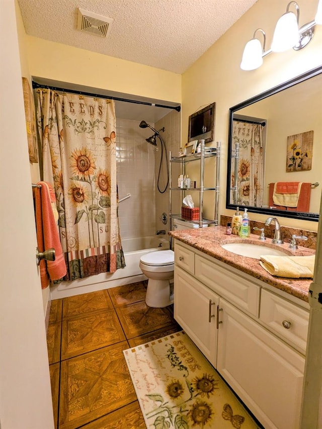 full bathroom with tile patterned floors, toilet, a textured ceiling, vanity, and shower / bathtub combination with curtain