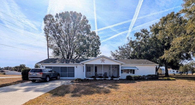 ranch-style home with a front yard and covered porch