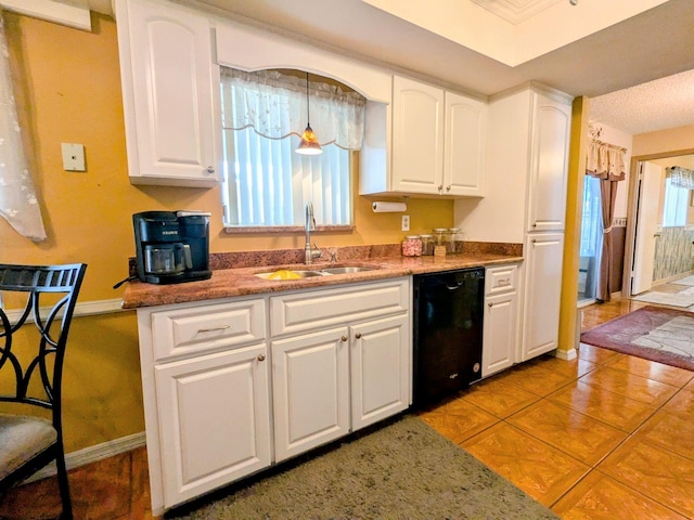 kitchen featuring decorative light fixtures, black dishwasher, sink, and white cabinets