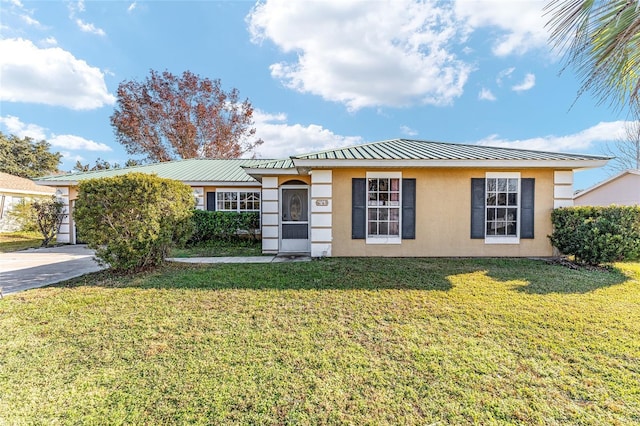 ranch-style home featuring a front yard