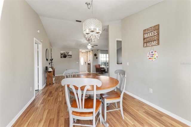 dining space featuring a chandelier and light wood-type flooring