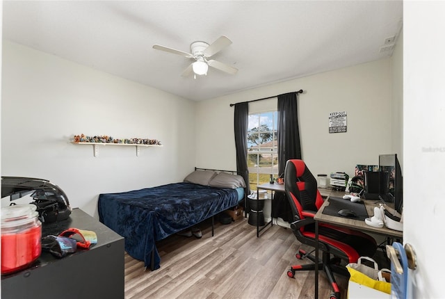 bedroom featuring ceiling fan and hardwood / wood-style floors