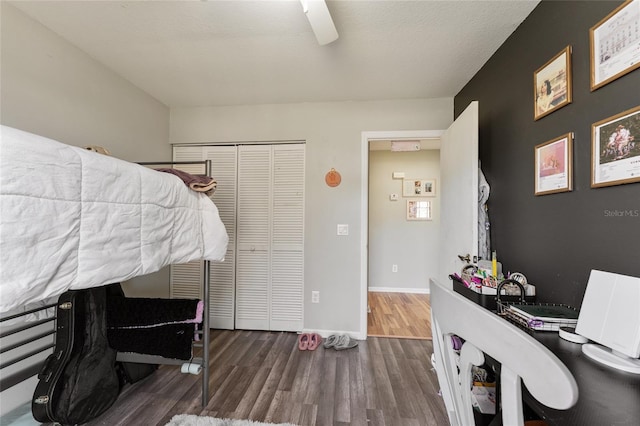 bedroom featuring ceiling fan and dark hardwood / wood-style flooring