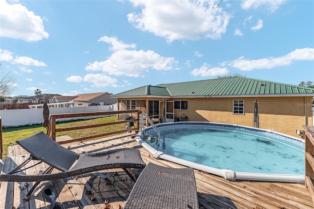 view of pool featuring a wooden deck