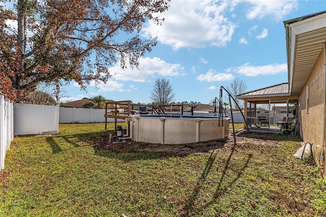 view of yard with a fenced in pool