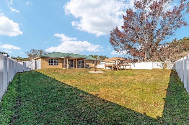 view of yard featuring a sunroom