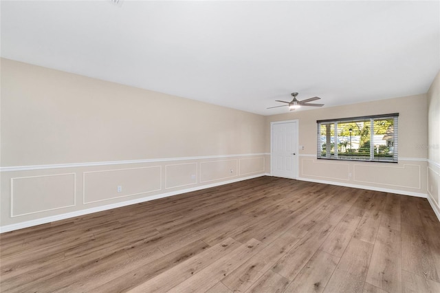 spare room featuring ceiling fan and light hardwood / wood-style flooring