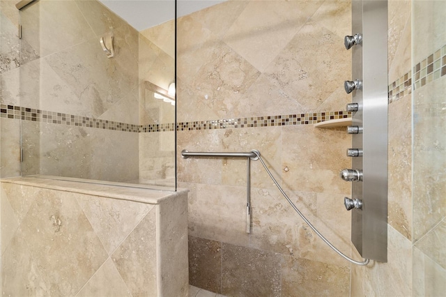 bathroom with tiled shower