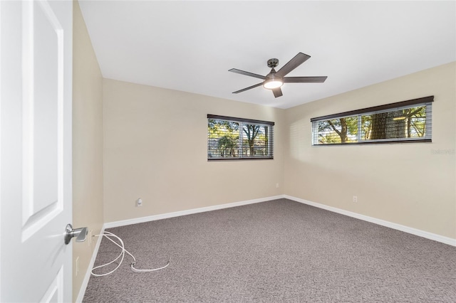 spare room featuring carpet floors and ceiling fan