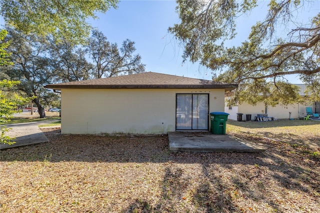 back of house with a patio