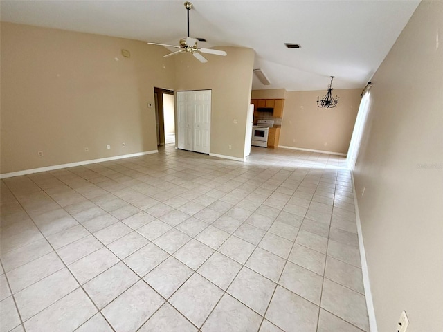 unfurnished living room with lofted ceiling, ceiling fan with notable chandelier, and light tile patterned floors