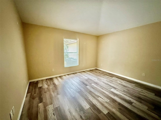 empty room with hardwood / wood-style floors