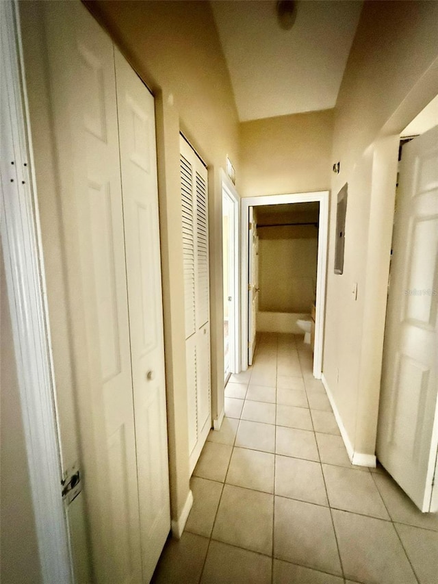 corridor featuring light tile patterned floors