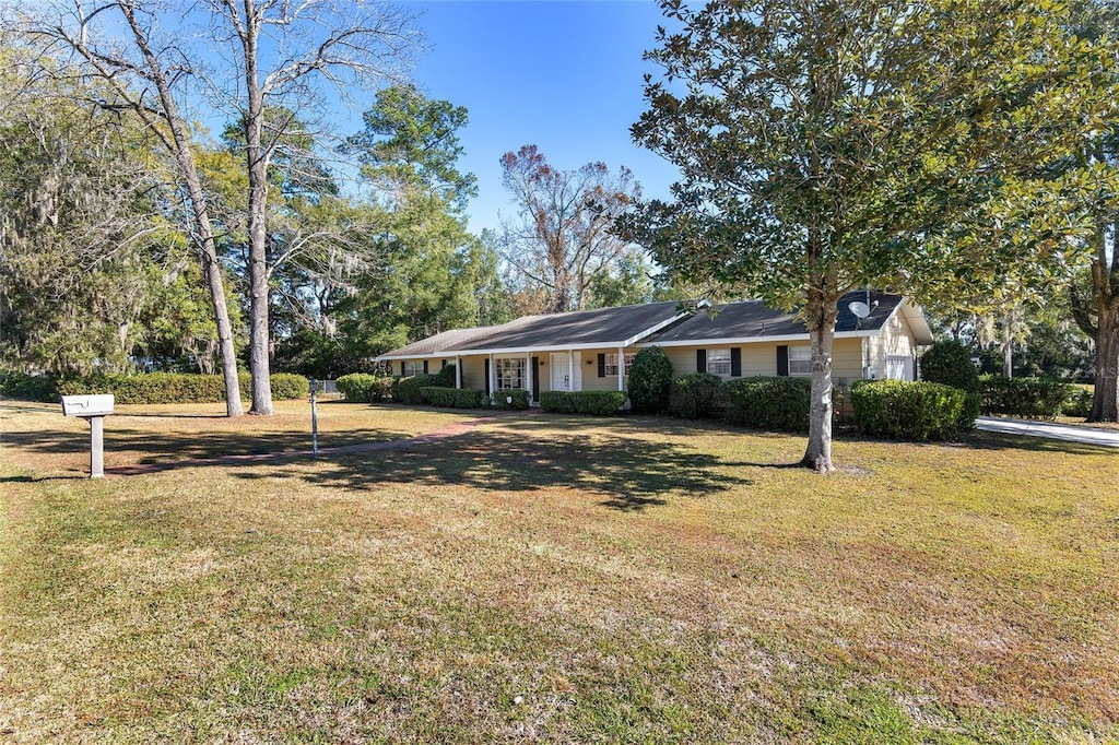 ranch-style house with a front yard