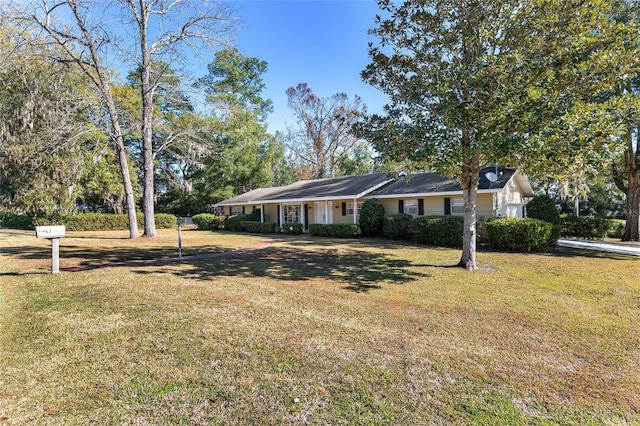 ranch-style house with a front yard