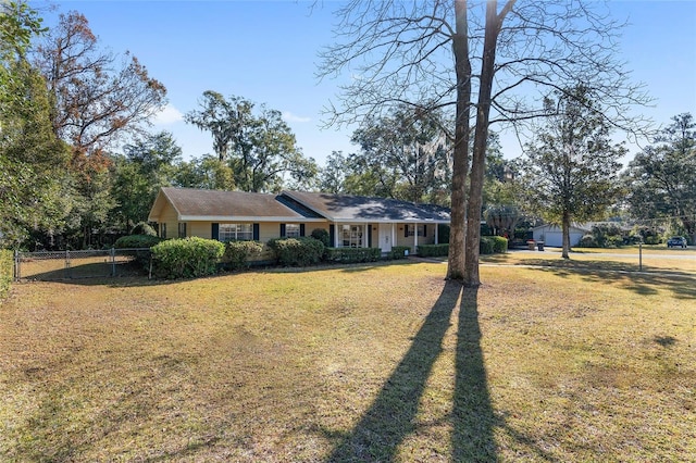 ranch-style house featuring a front lawn