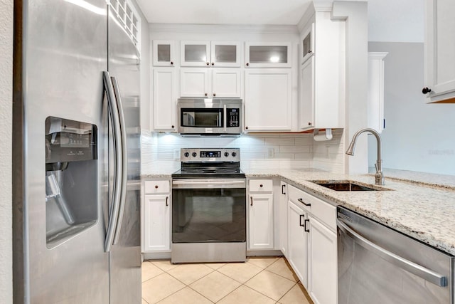 kitchen featuring stainless steel appliances, white cabinets, and sink