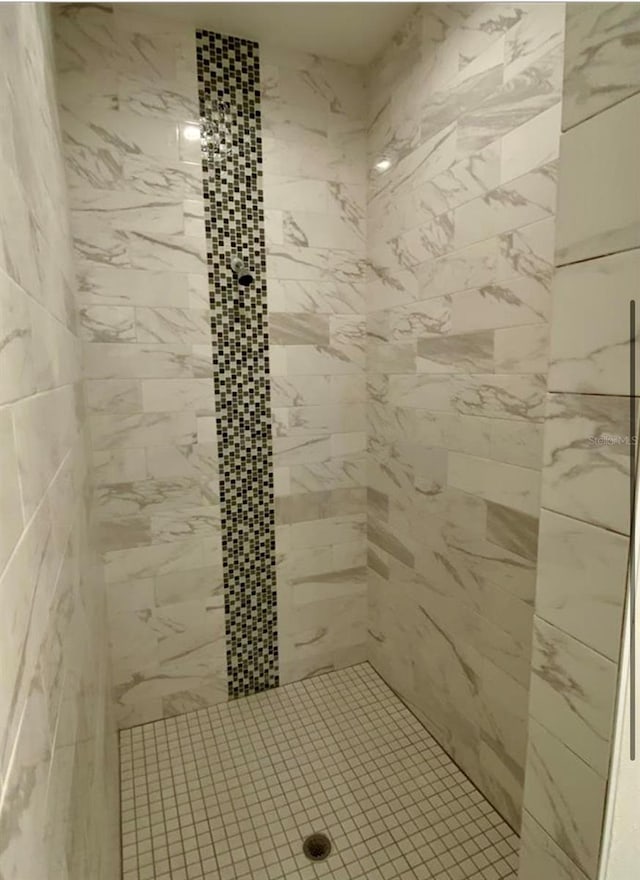 bathroom with a tile shower