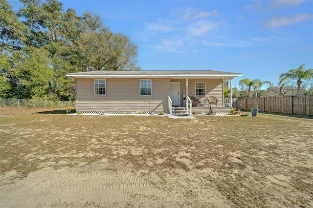 view of front of home featuring a porch and a front yard