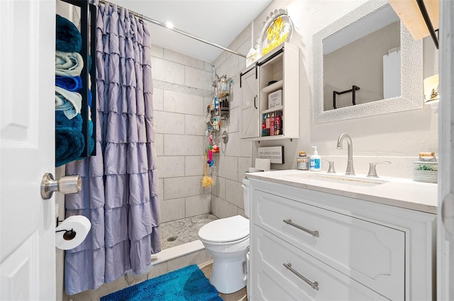 bathroom featuring toilet, curtained shower, and vanity