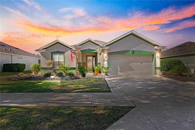 ranch-style home with a yard and a garage