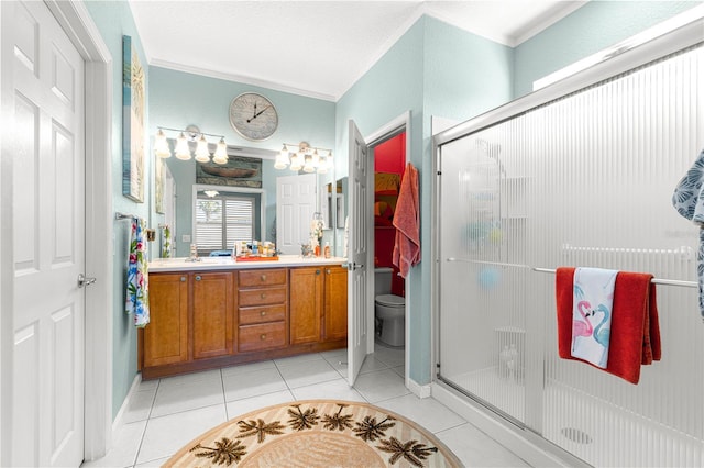 bathroom with tile patterned flooring, toilet, walk in shower, vanity, and crown molding