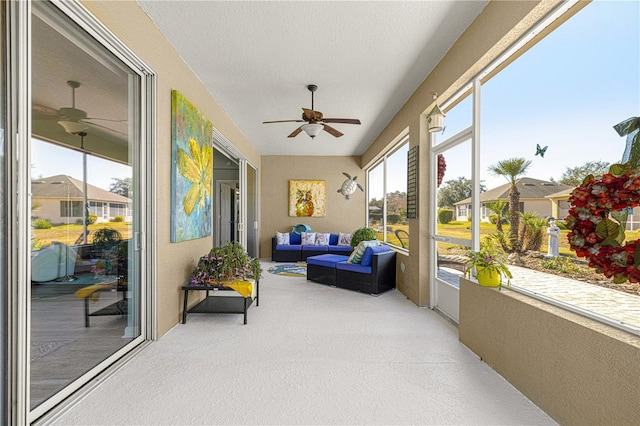 sunroom / solarium with ceiling fan