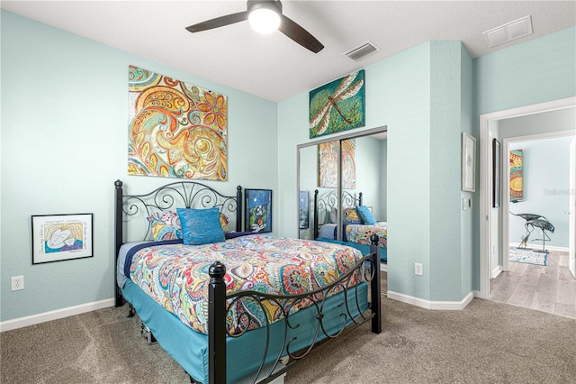 carpeted bedroom featuring ceiling fan