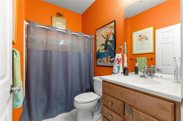 bathroom with toilet, a shower with shower curtain, vanity, and a textured ceiling