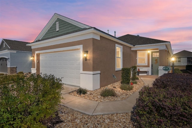 view of front of property with a garage