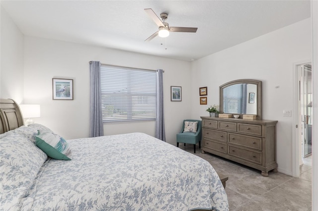 bedroom featuring light tile patterned floors and ceiling fan