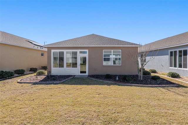 rear view of property with a yard