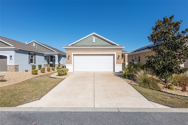 view of front of property featuring a front yard and a garage