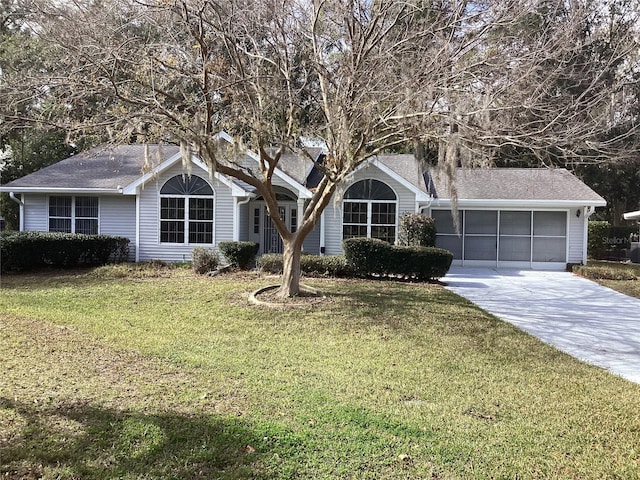 ranch-style home with a front yard and a garage