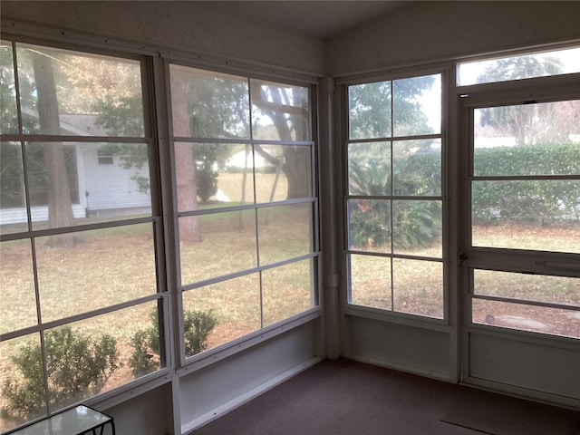 unfurnished sunroom with a wealth of natural light