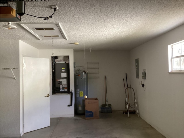 garage featuring electric water heater, heating unit, and electric panel