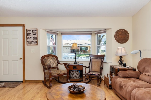 sitting room with hardwood / wood-style floors