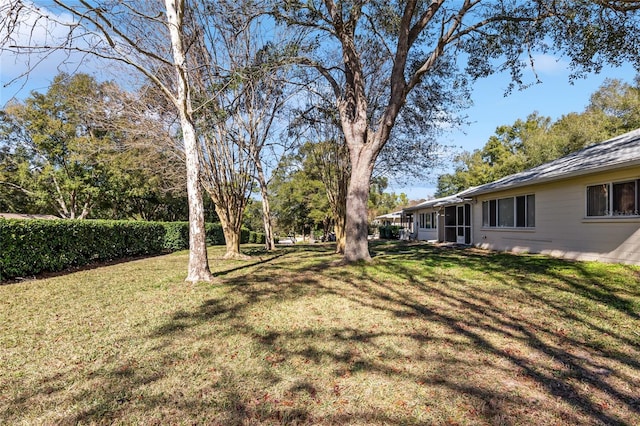 view of yard featuring a sunroom