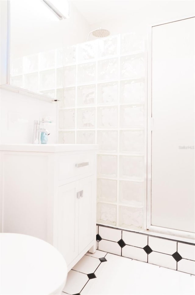 bathroom featuring tile patterned flooring and a shower