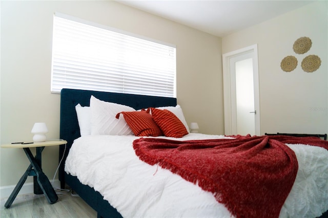 bedroom featuring hardwood / wood-style floors