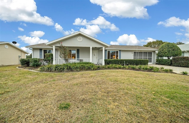 single story home with a front yard and covered porch