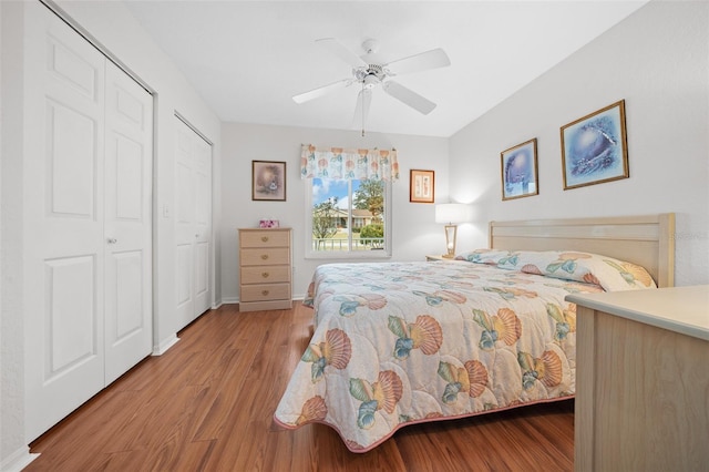 bedroom with ceiling fan and light hardwood / wood-style floors