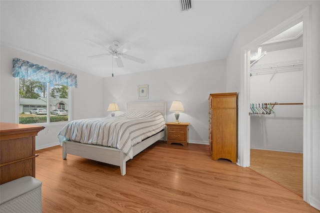 bedroom with ceiling fan and light hardwood / wood-style floors