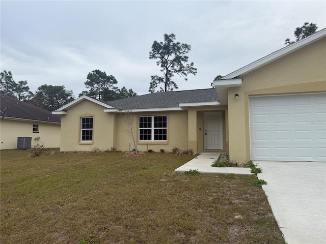 single story home featuring a garage, a front lawn, and central air condition unit