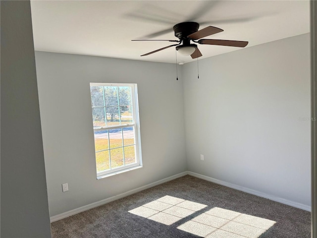 carpeted empty room with ceiling fan