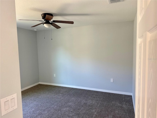 spare room with ceiling fan and carpet floors