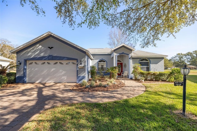 ranch-style house with a front yard and a garage